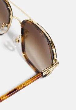 Tory Burch Sunglasses - Shiny Gold-Coloured/Dark Tortoise 7 Tory Burch Sunglasses - Shiny Gold-Coloured/Dark Tortoise -Tory Burch 88fa5ab40f5e4f8f85ec59d225cb0481